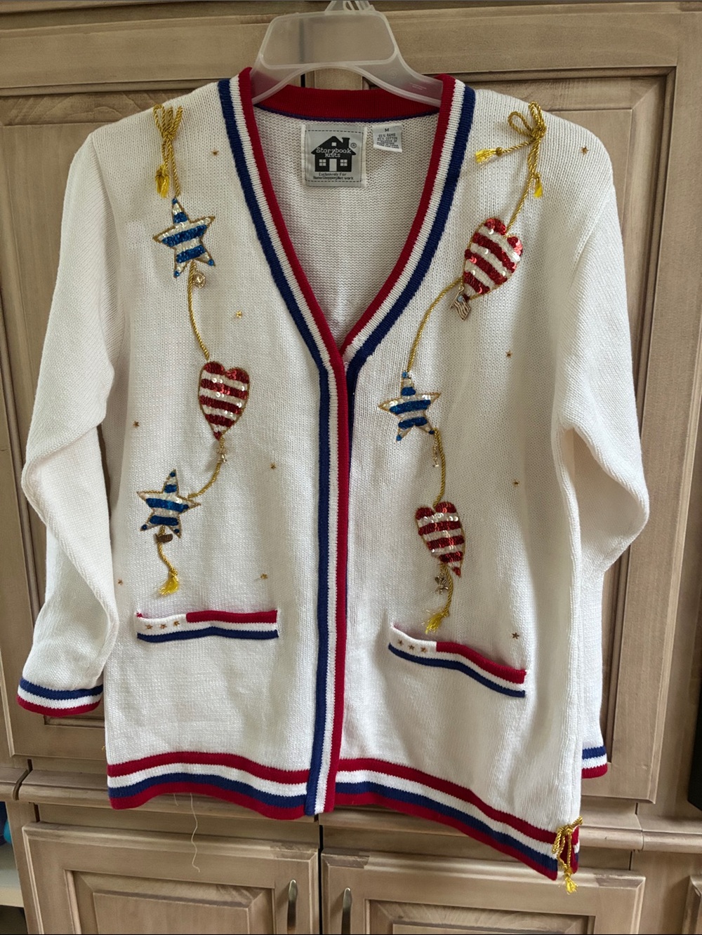 Storybook Knits White Cardigan with Red and Blue Trim & Gold Accents